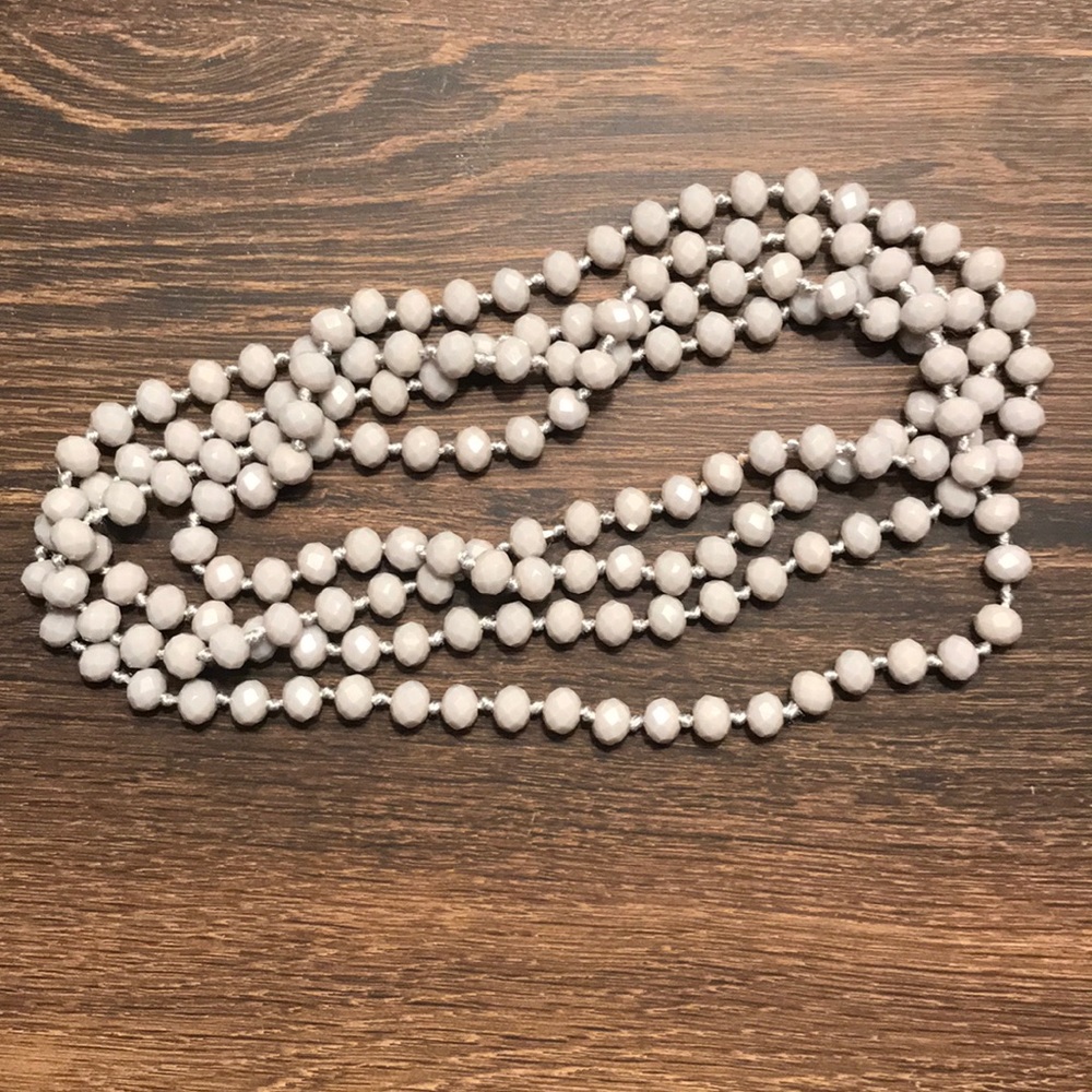 gray long bead necklace